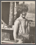 Twelve-year old girl of family of nine living in one-room hut built over the chassis of abandoned Ford truck in open field on U.S. Route 70 between Camden and Bruceton, Tennessee. Near backward Tennessee section.