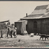 Children at well of farm purchased for Lake of the Ozarks recreation project, near Kaiser, Missouri.