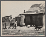 Children at well of farm purchased for Lake of the Ozarks recreation project, near Kaiser, Missouri.
