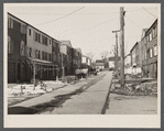 Radburn, New Jersey, a privately financed model town which furnished some of the ideas for the Suburban Resettlement Administration's Greenbelt towns. A roadway, not a thoroughfare, back of a unit of houses.