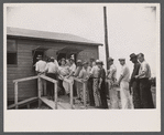Workmen receiving paychecks, Greenbelt, Maryland.