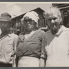 [Man and two women in front of shack. Alabama?]