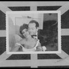 Man embracing seated woman