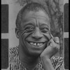 James Baldwin smiling in headshot
