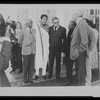 James Baldwin standing with others at Issyk-Kul Forum