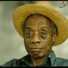 James Baldwin in straw hat