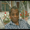 James Baldwin in checkered shirt in Saint-Paul