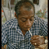 James Baldwin in checkered shirt in Saint-Paul