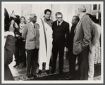 James Baldwin standing with others at Issyk-Kul Forum