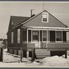 Cheap false brick tarpaper-covered wooden house typical of subdivision sections in Franklin Township, Amwell Road, West New Brunswick near Derussey land, New Jersey.