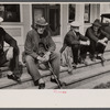 Fair at Albany, Vermont. The old timers take to the steps of the general store.