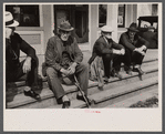 Fair at Albany, Vermont. The old timers take to the steps of the general store.