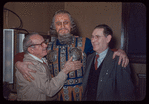 Unidentified performer in costume for Die Meistersinger von Nürnberg, with unidentified others, at the Metropolitan Opera