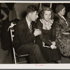 Striker and his fiancee (sitdown strike romance) in the Women's Auxiliary room in Pengally Hall. Flint, Michigan.