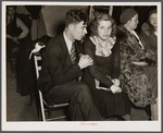 Striker and his fiancee (sitdown strike romance) in the Women's Auxiliary room in Pengally Hall. Flint, Michigan.