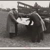 Officials examining plan of Greenbelt, Maryland.