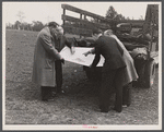 Officials examining plan of Greenbelt, Maryland.
