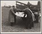Officials examining plan of Greenbelt, Maryland.