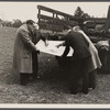 Officials examining plan of Greenbelt, Maryland.