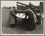 Officials examining plan of Greenbelt, Maryland.