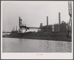 Steel plant in Buffalo, New York. Cargo comes in ships, is unloaded by crane.
