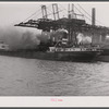 Ship unloading ore at plant. Buffalo, New York.