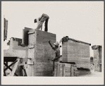 Rammed earth construction near Birmingham, Alabama. The bolts are removed and the holes plugged with mortar.
