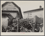 Close housing adjoining junk. Milwaukee, Wisconsin.