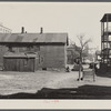 Exterior of house on alley between 7th and 8th and Milbourn and State Streets. Milwaukee, Wisconsin.