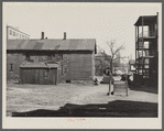Exterior of house on alley between 7th and 8th and Milbourn and State Streets. Milwaukee, Wisconsin.