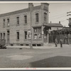 North 10th and McKinley Streets, house next to junk yard. Milwaukee, Wisconsin.