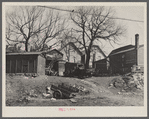 Closeup of rear of houses in 900 block on West Clyburn Street. Milwaukee, Wisconsin.