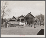 Rear of group of houses in 900 block on West Clybourn Street. Milwaukee, Wisconsin.