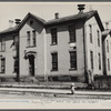 Exterior of Cincinnati school house condemned 37 years ago as such, now housing 12-15 white families.