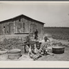 Children of Negro sharecropper at pump. Near West Memphis, Arkansas.