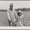 R.E. Sneed, rehabilitation client and eight year old daughter on cotton cultivator. Near Batesville, Arkansas.