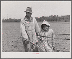 R.E. Sneed, rehabilitation client and eight year old daughter on cotton cultivator. Near Batesville, Arkansas.
