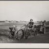 A homesteader at Decatur, Indiana, with a garden tractor. Decatur Homesteads.