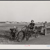 A homesteader at Decatur, Indiana, with a garden tractor. Decatur Homesteads.