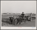 A homesteader at Decatur, Indiana, with a garden tractor. Decatur Homesteads.