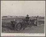A homesteader at Decatur, Indiana, with a garden tractor. Decatur Homesteads.