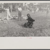 Firemen's muster. Boothbay center, Maine. Coach directing those crew to take best advantage of the wind. Note that he is under the hose stream.