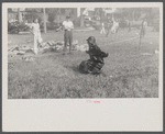Firemen's muster. Boothbay center, Maine. Coach directing those crew to take best advantage of the wind. Note that he is under the hose stream.
