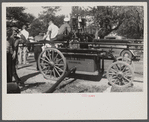 Firemen's muster. Boothbay center, Maine. Typical handpump manned by twenty-four men, twelve along each of the handle bars.