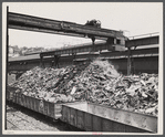 Steel manufacture. Back into production go these carloads of scrap metal. The melting of alloy steels for defense work requires that steel mill scrapyards such as this be constantly filled.