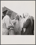 Teheran, Iran. Mrs. Louis Dreyfus, wife of the United States Minister to Iran, talking with native girls.