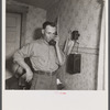 Earl Cazier, manager of St. Anthony stud service, receives call for bull. Fremont County, Idaho.