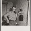 Earl Cazier, manager of St. Anthony stud service, receives call for bull. Fremont County, Idaho.