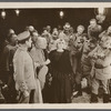 Publicity photograph of Rita Jolivet, L. Rogers Lytton, and unidentified others in the motion picture Lest We Forget