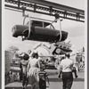 Photograph of suspended automobile body in the Chrysler Pavilion production ride